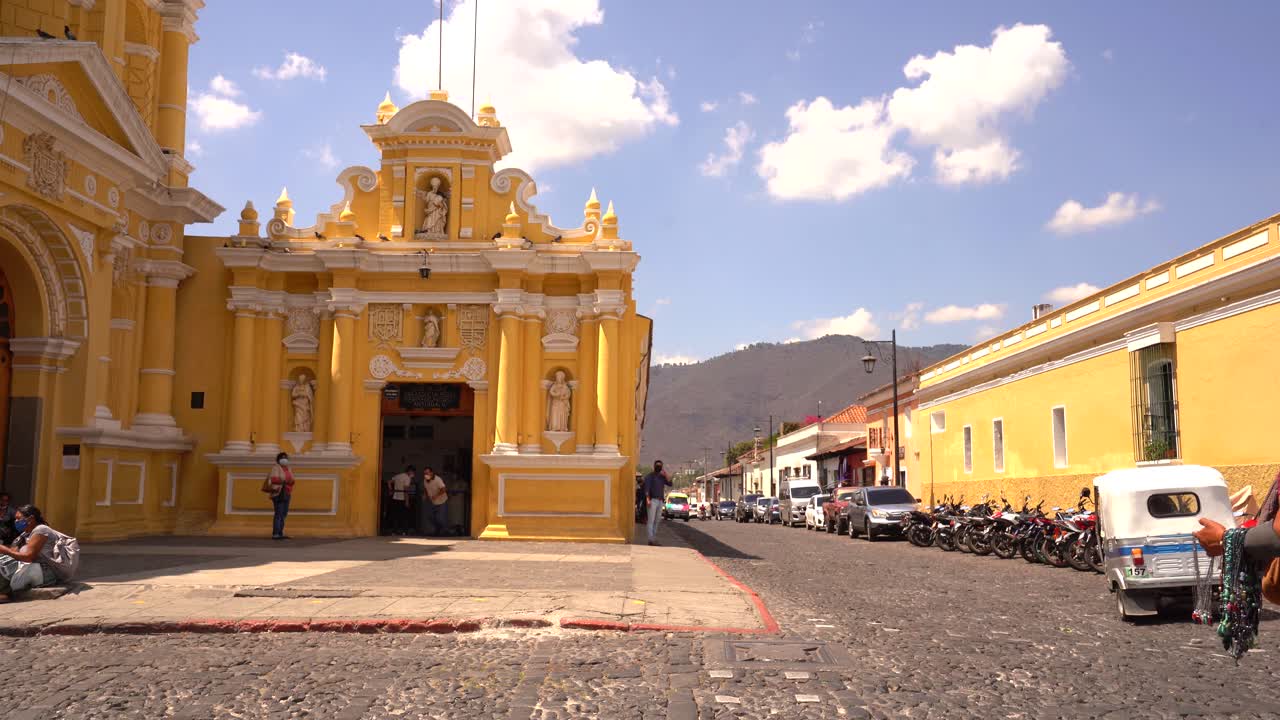 Historic Street View in Antigua Guatemala with Colonial Architecture and Tuk-tuk