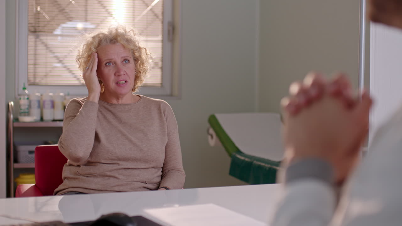 Woman consulting with doctor in clinic