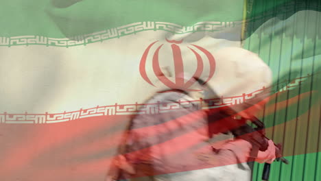 animation of flag of iran over caucasian male soldier with weapon