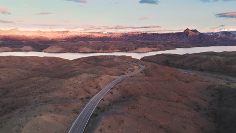 flying over winding desert road toward coloardo river