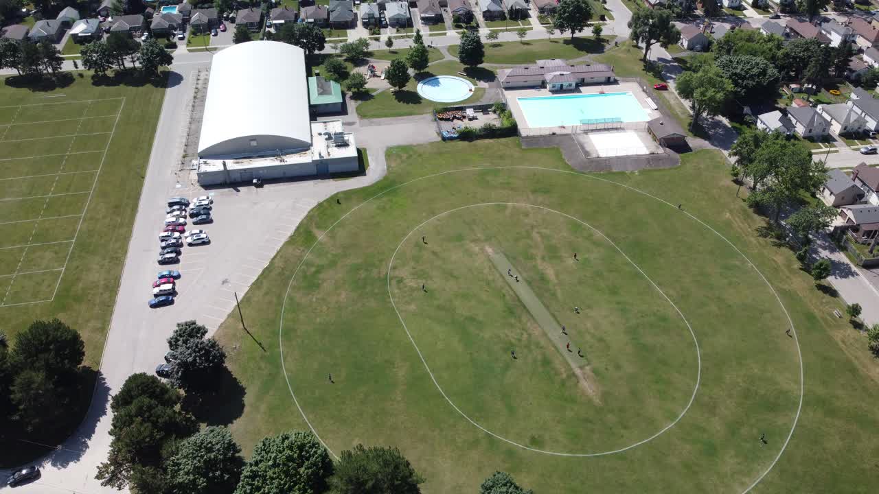 Aerial footage of a small cricket pitch in Canada. This sport is still growing in Canada largely due to immigration