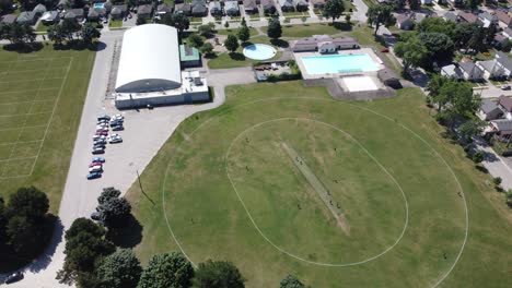 aerial footage of a small cricket pitch in canada. this sport is still growing in canada largely due to immigration