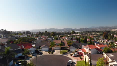 aerial fly into a suburban house at the end of a cul-de-sac