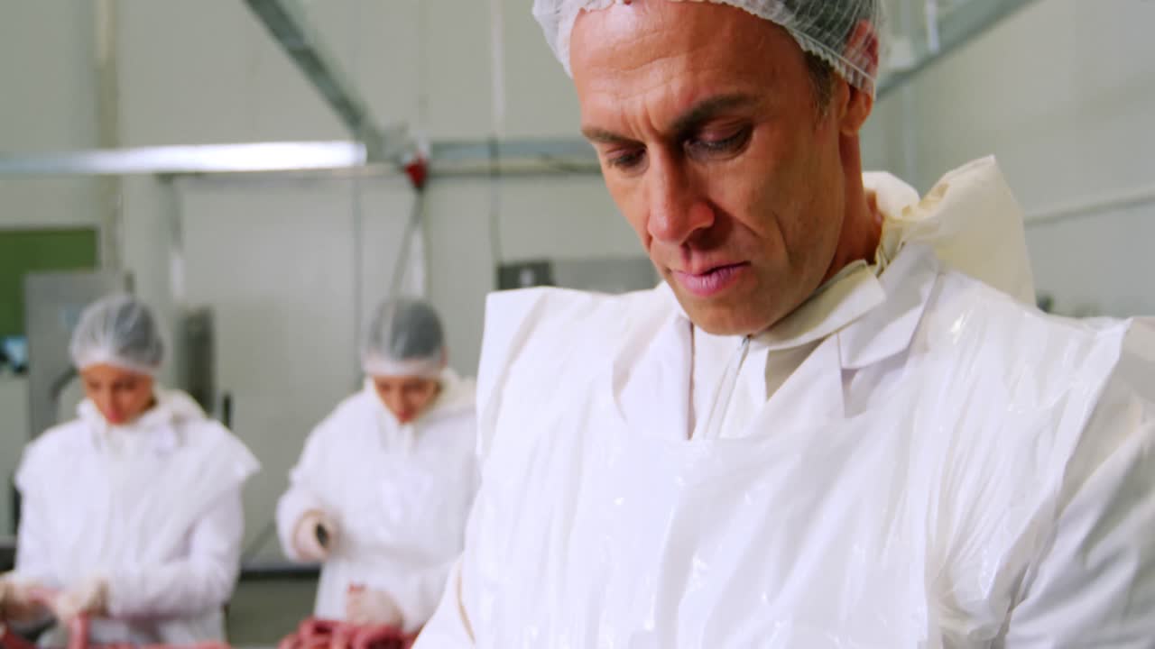 Butcher using digital tablet