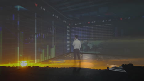 businessman analyzing financial graphs and data over sunset landscape animation