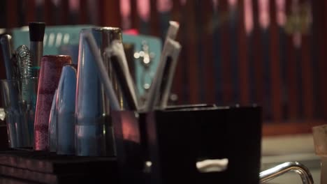 the counter of a bar with an ice grinder and the tools on it