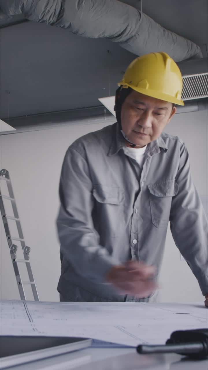 Vertical of Engineer Editing Blueprint