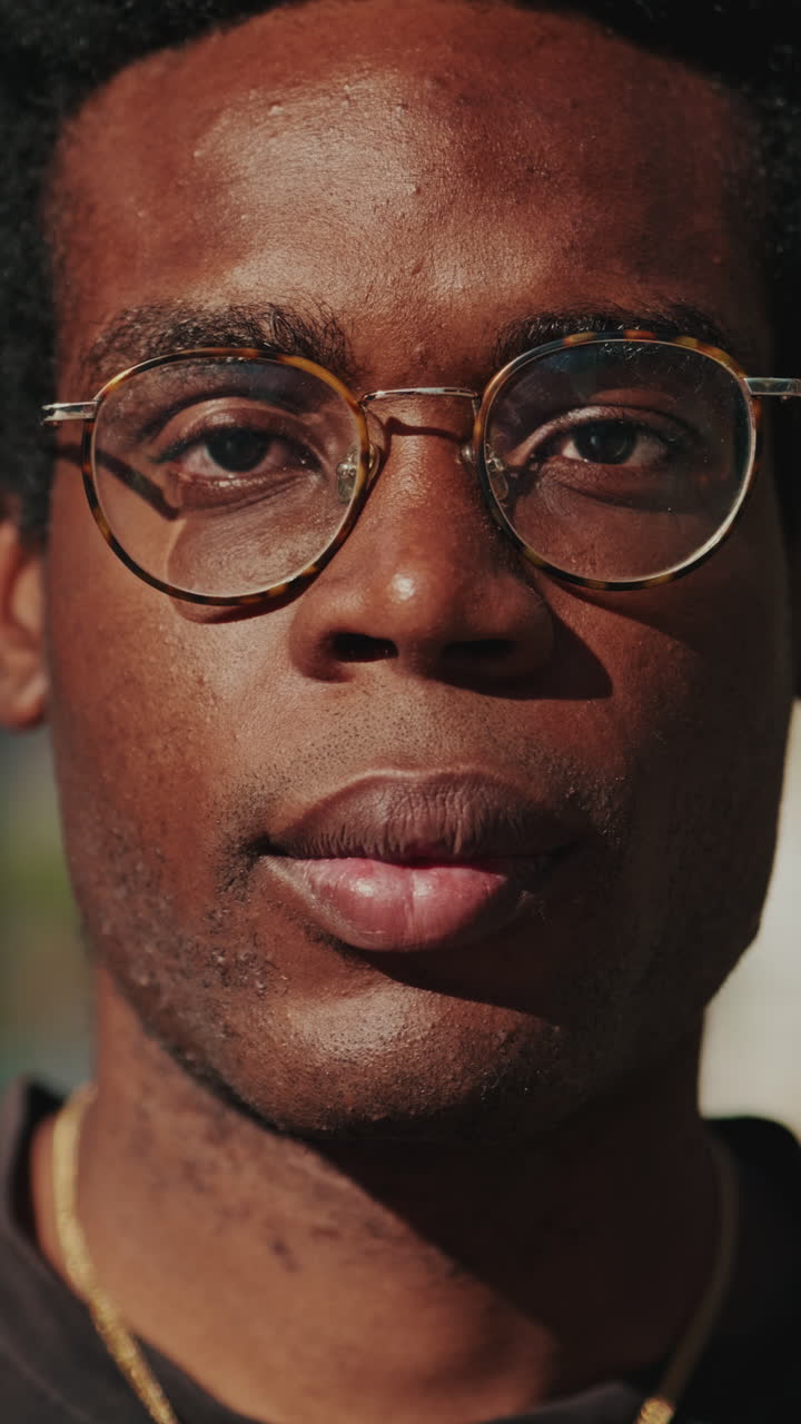 Close-up Portrait of Young African American Man with Glasses