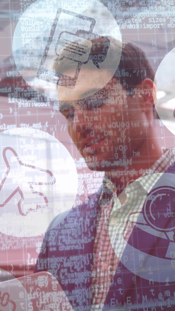 Vertical video: Man at trade show reading tablet after alert, code and icon graphics overlaying man