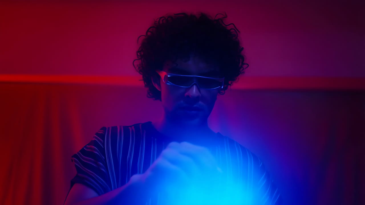 Person in Futuristic Glasses with Blue Neon Light
