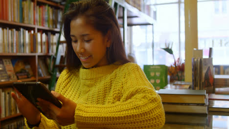 teenage girl using digital tablet in library 4k