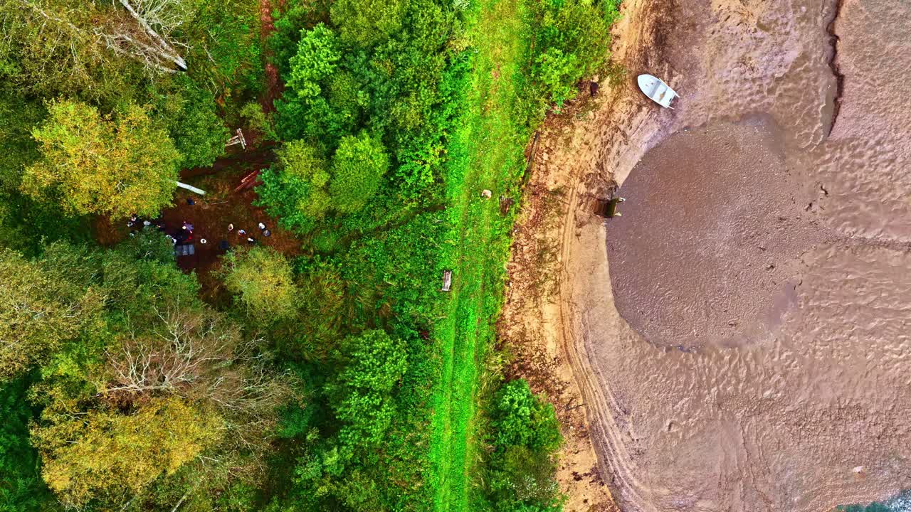 Overhead View Of People Harvesting Fish On The Pond. - aerial timelapse shot