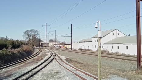 a high angle on an amtrak train passing at high speed