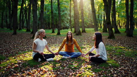 women meditating in a forest