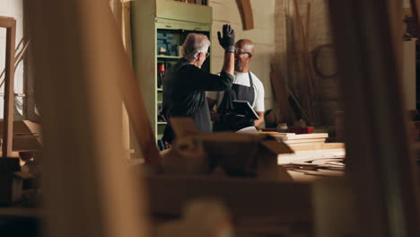 woodworkers collaborating in a workshop