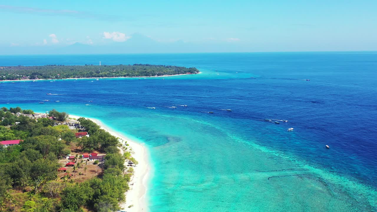 Many boats gliding on the calm sea between islands. Aerial seascape, Gili, Indonesia