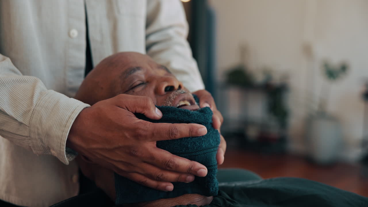 Man Receiving Relaxing Hot Towel Treatment in Barbershop