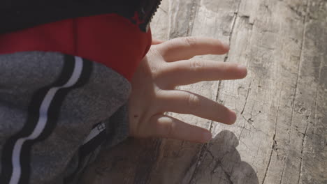 close-up of a toddler's hand outdoors