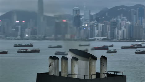 warm smoke pushed out of the funnel of a cargo vessel