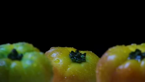 Ripe-Heirloom-Tomatoes-Close-Up:-Slow-Motion-Water-Spray