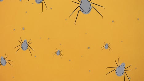 animación de arañas que caen sobre un fondo naranja