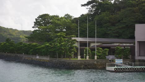 peaceful morning in toba bay, panning shot over mikimoto pearl island