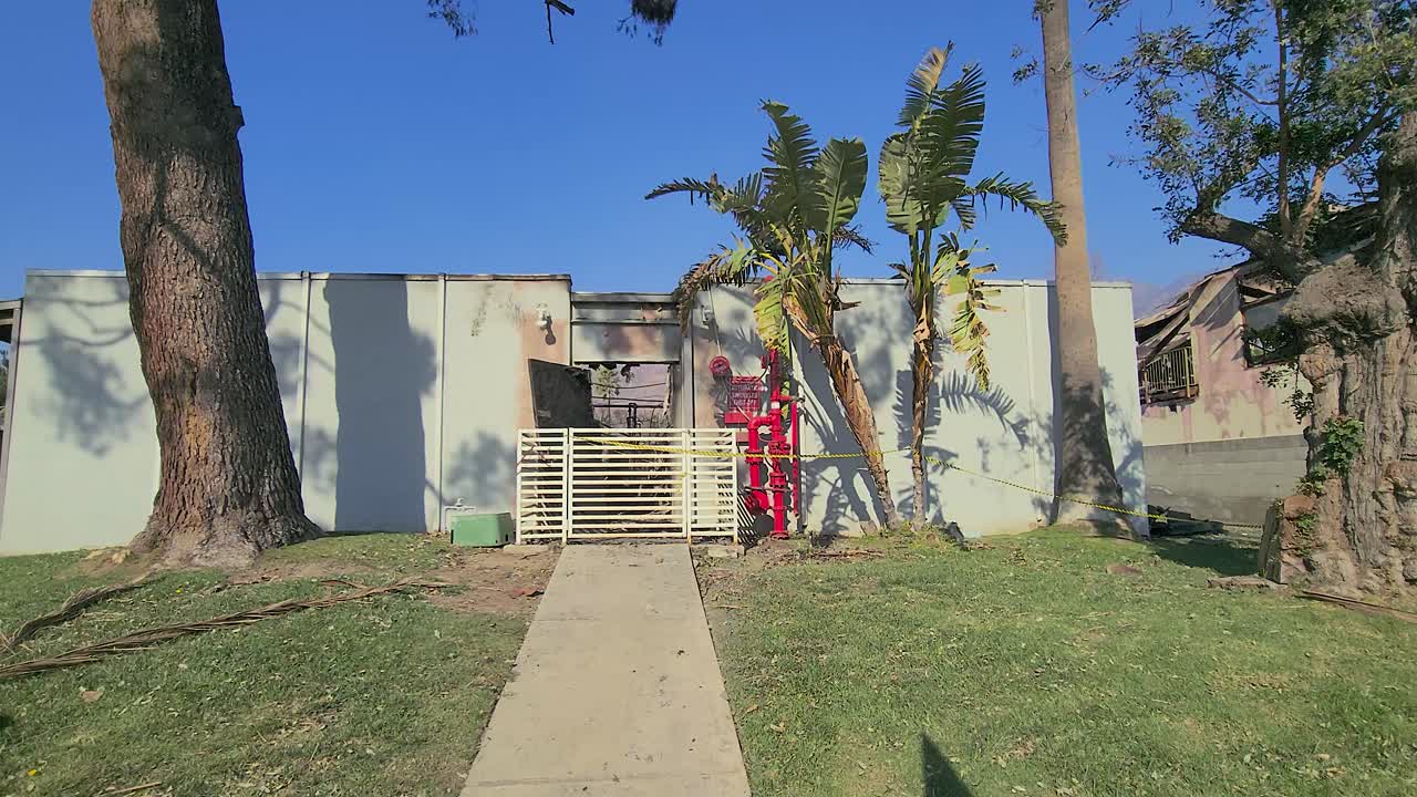 Burnt building aftermath in Los Angeles, California, showing damage from recent fires
