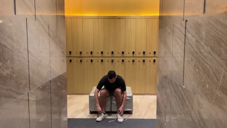 Wealthy-Asian-Millennial-Man-Undressing-in-Luxurious-Upscale-Changing-Room