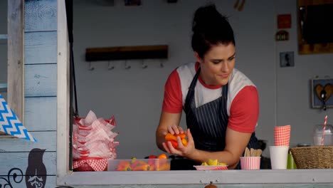 waitress preparing meal for customer