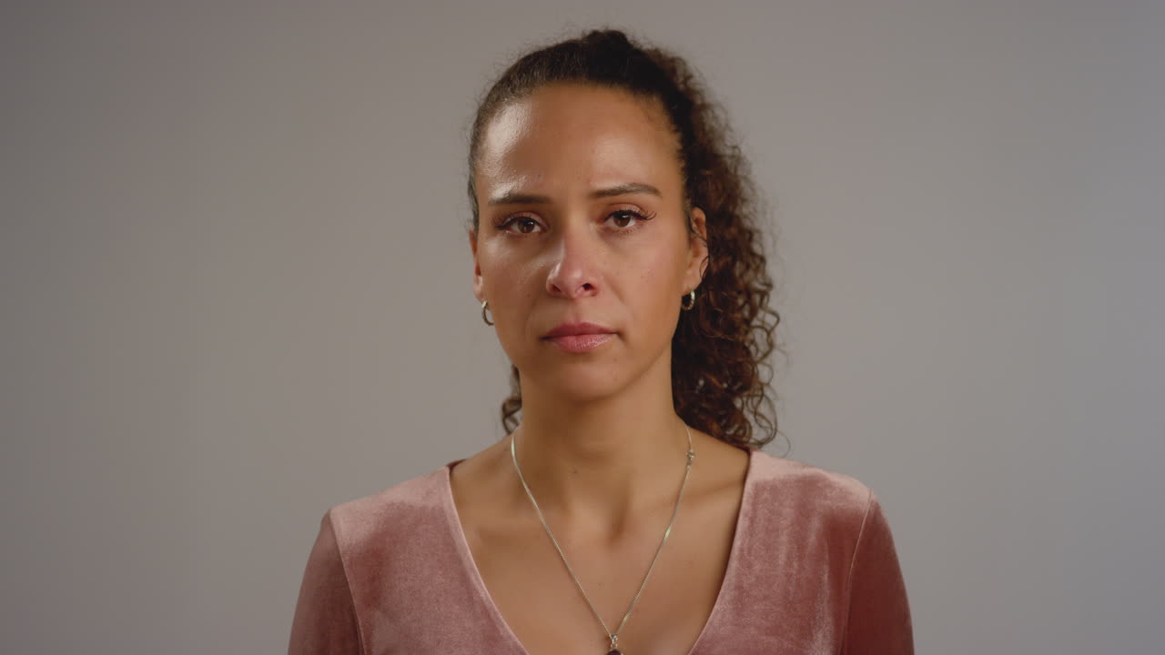 Concerned Woman Looks at Camera