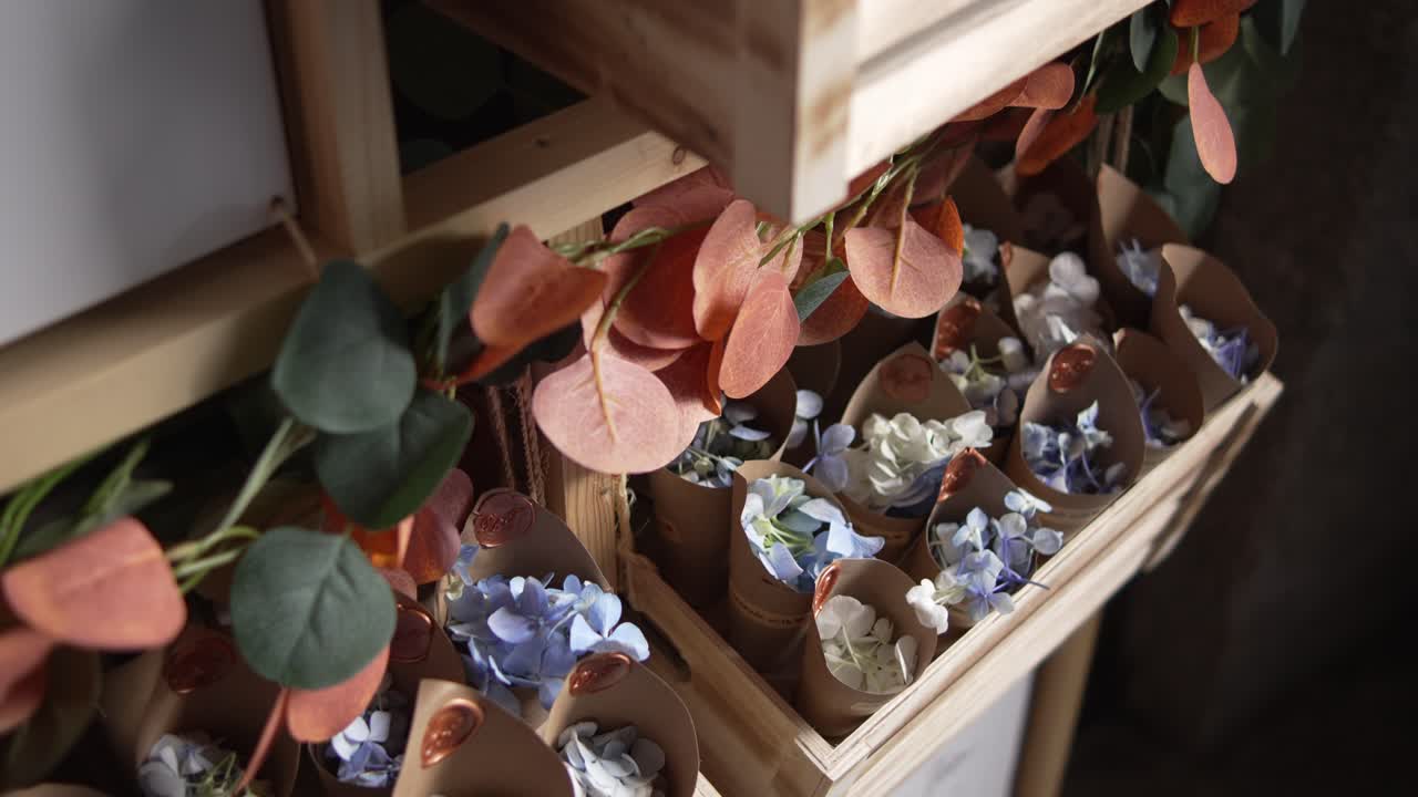 Rustic petal confetti in cones ready for the joyful wedding ceremony exit