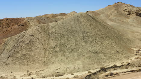 rotating view around a section of dry sandy mountains in the rainbow basin part of the mojave desert