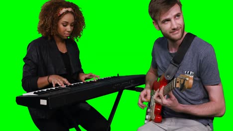 musicians playing piano and guitar