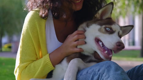 woman with husky dog in park