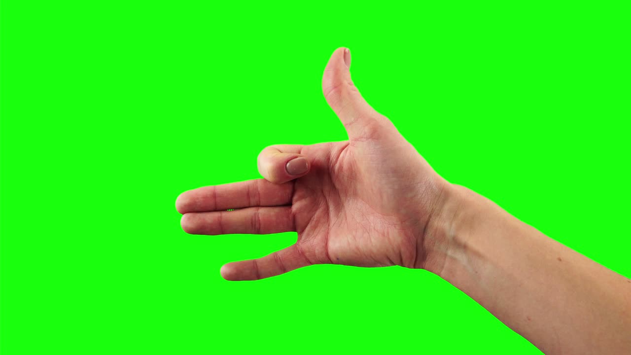Closeup view of female hand showing a sign of barking dog on a green screen background