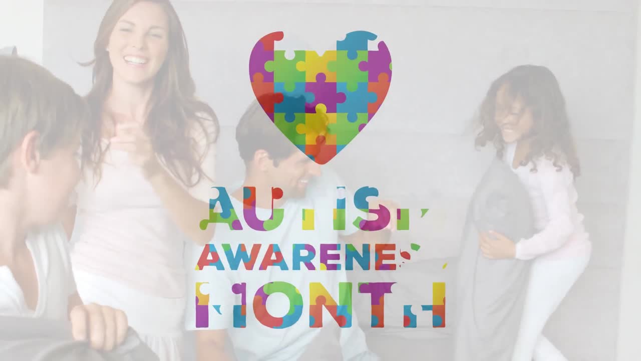 Autism Awareness Month text over family having a pillow fight on the bed