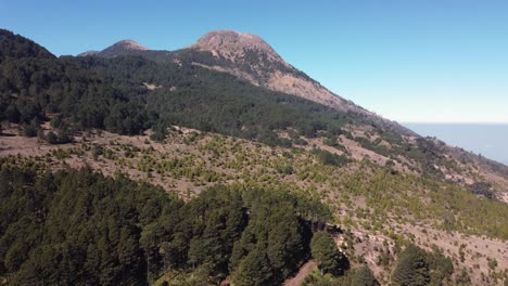 Aerial-retreats-from-Tajumulco-volcano-mountain-slope-in-Guatemala