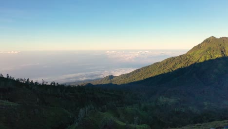 amazing aerial view of a creator at kawah ijen volcano with turquoise sulfur lake in the morning