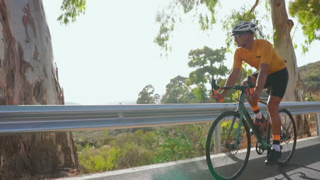 a cyclist on a road bike, a man enjoys outdoor exercise on a quiet morning road. the slow-motion portrayal amplifies the concept of extreme sports