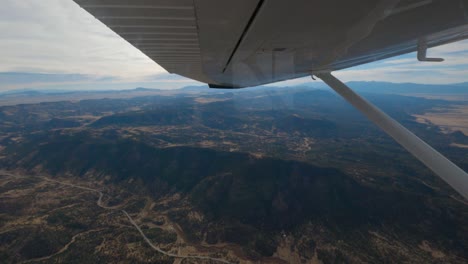 cessna 182 experiencing turbulence while turning over the colorado rocky mountains