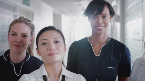 portrait of female medical team standing in hospital corridor