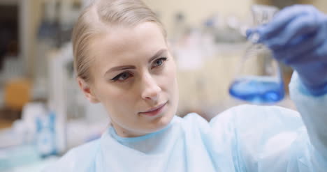 Scientist-Mixing-Liquid-At-Laboratory-3