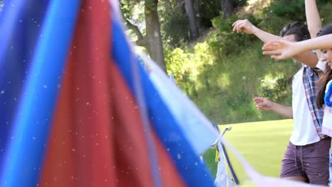 animation of white spots over people dancing at summer camp
