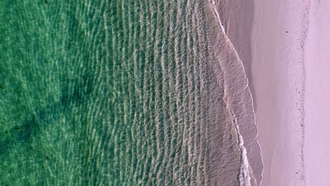 a-peaceful-beach-with-waves-crashing-on-the-sand-and-a-green-ocean-wave-coming-in-from-the-shore-and-a-green-ocean-wave-coming-in-from-the-top