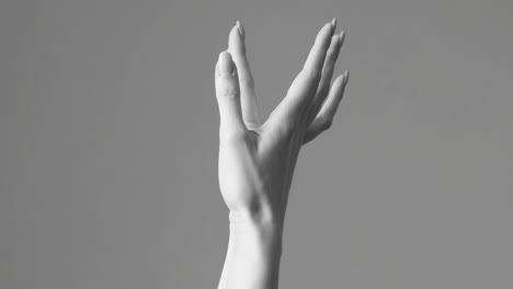 monochrome hand reaching upwards