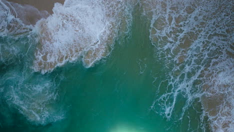 Kelingking-Beach---Overhead-View-Of-Waves-In-The-Sandy-Beach