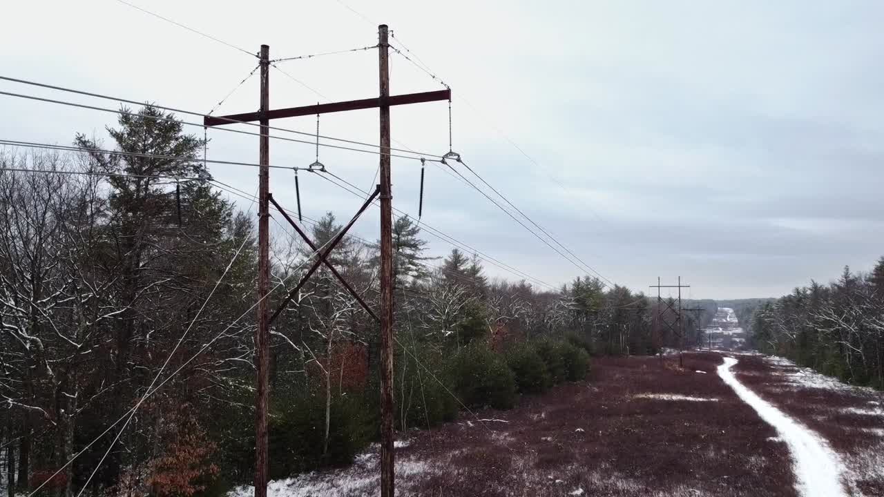 Ascending Aerial footage at an electrical power line corridor in eastern Massachusetts