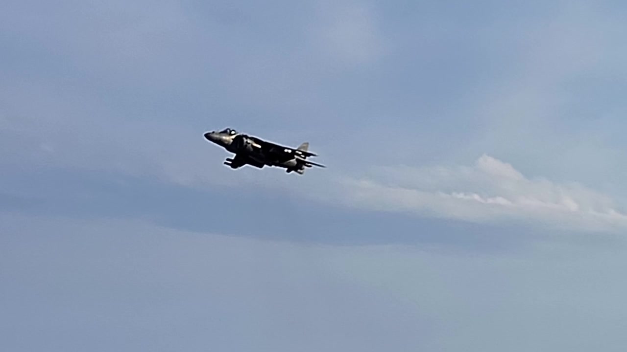 Sea Harrier fighter in a hover. AV-8B Harrier II. V-STOL. Armed fighter flying at low altitude. Spain.