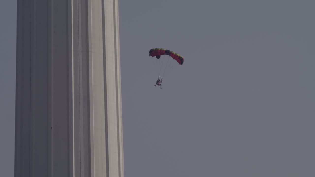 Base jumpers jumping from Menara tower in Kuala Lumpur.