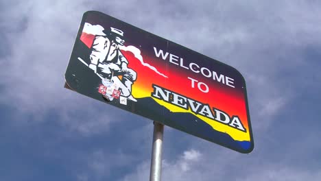 a sign welcomes visitors to nevada